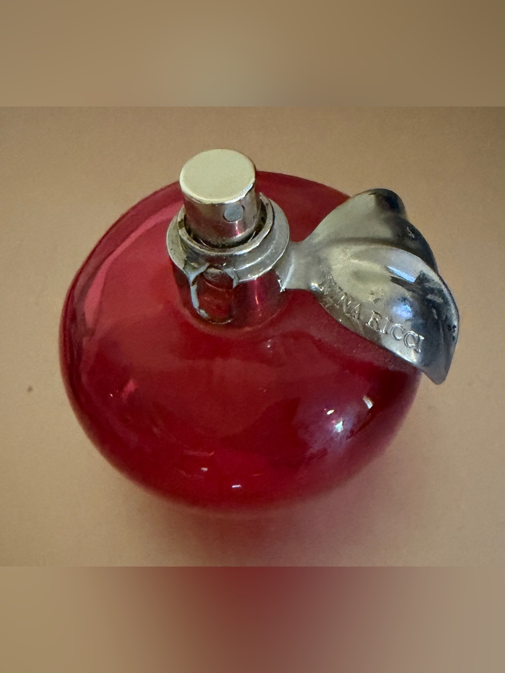 Nina Ricci Red Apple-Shaped Fragrance Bottle with Silver Leaf - Picture 2 of 7
